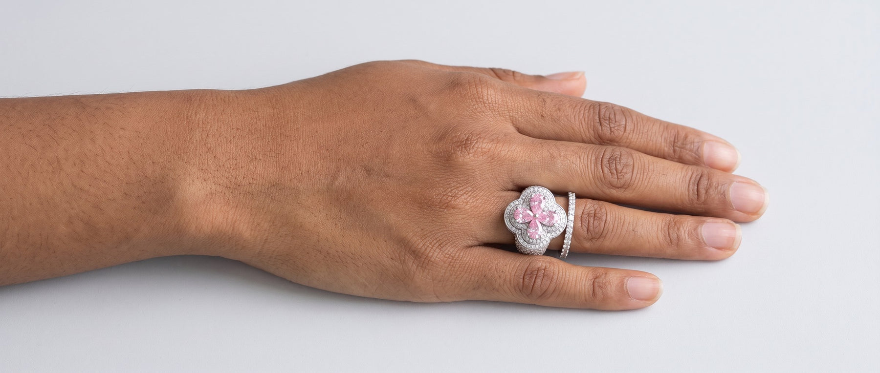 Moissanite and sterling silver rings from Jamilah Jewels, worn on the hand