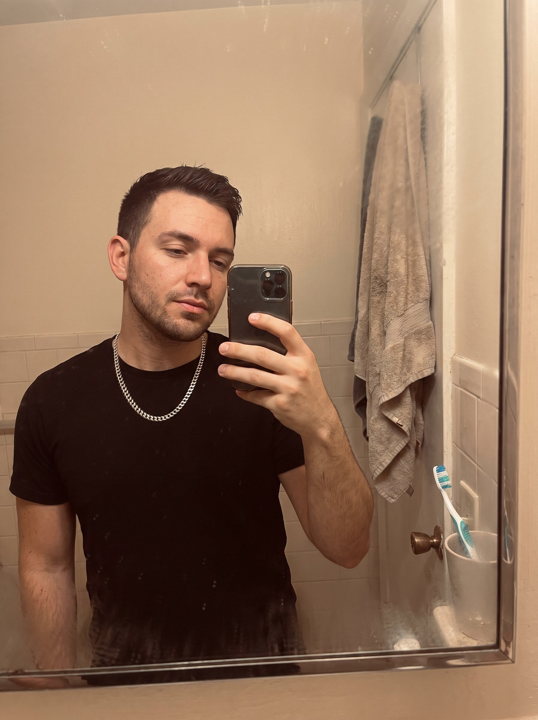 A man wearing a 5mm moissanite Cuban chain