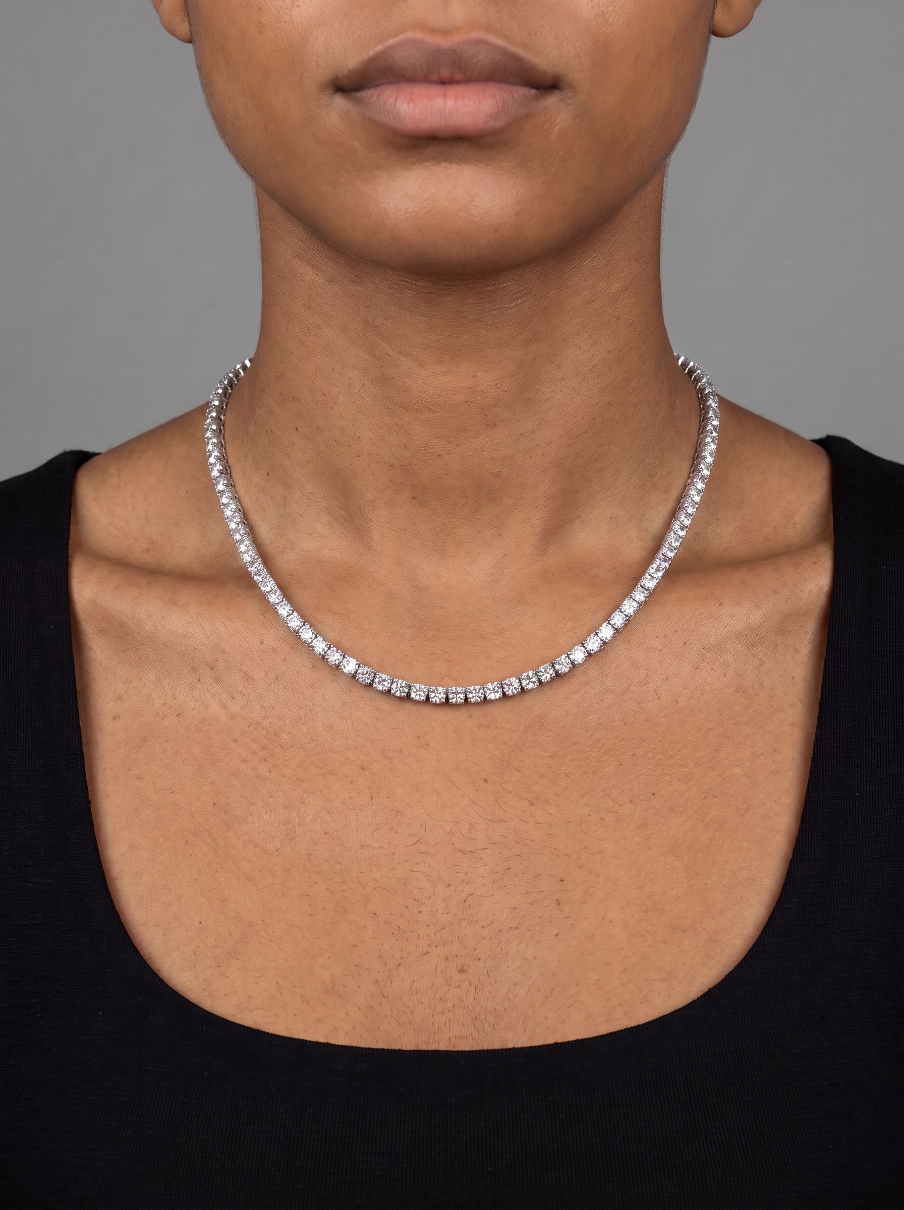 The same moissanite tennis chain worn at 20 inches, just below the collarbone