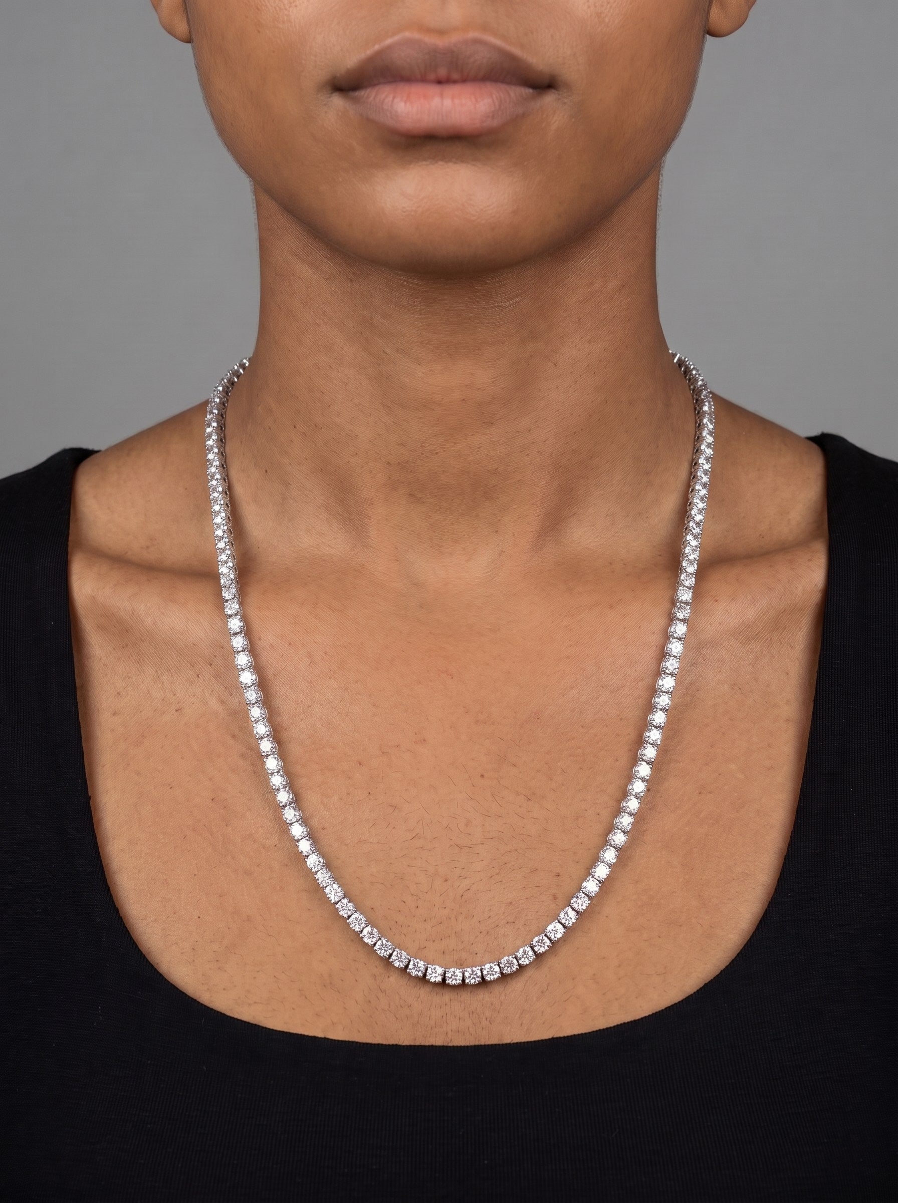 The same moissanite tennis chain worn at 22 inches, falling to the upper chest