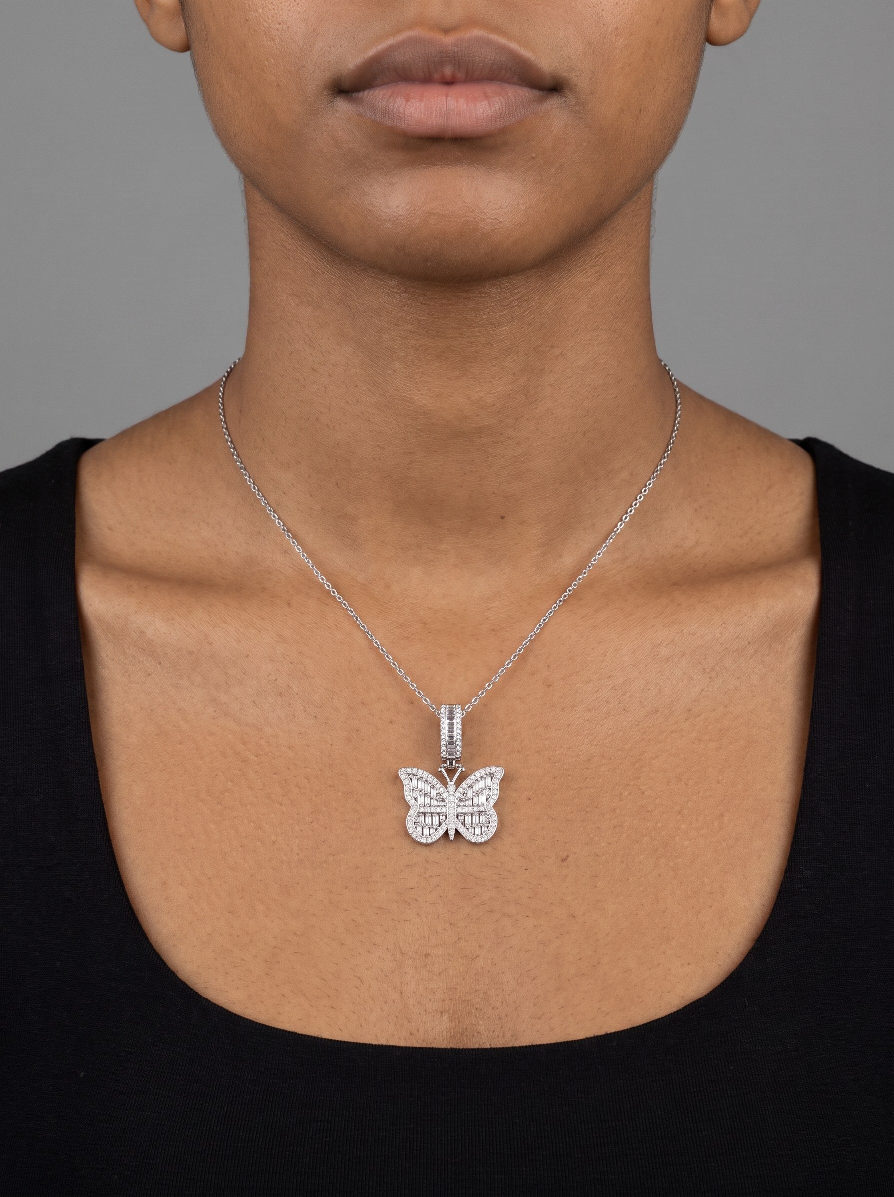 A moissanite pendant on an 18 inch chain, sitting at the collarbone