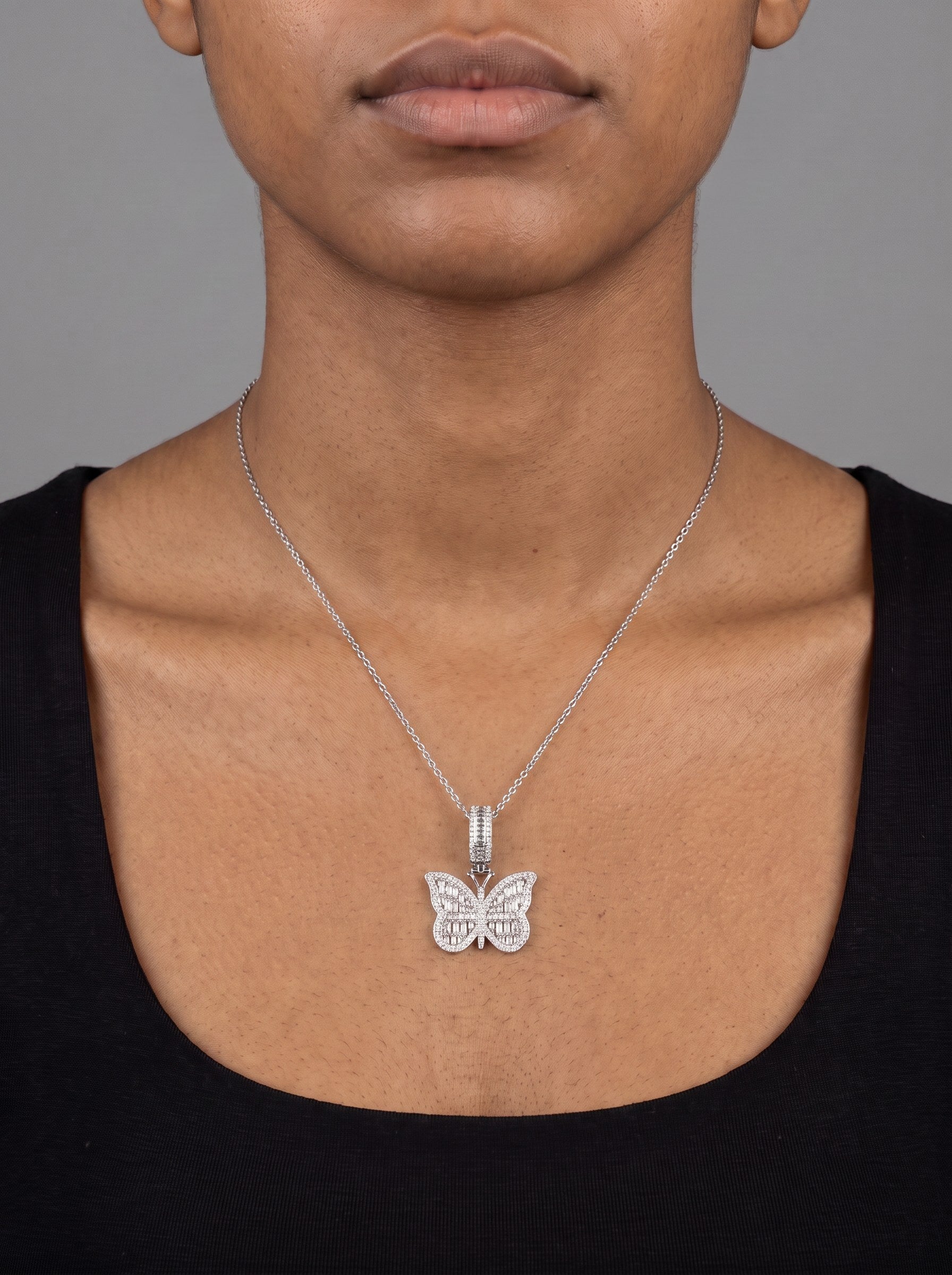 The same moissanite pendant on a 20 inch chain, just below the collarbone