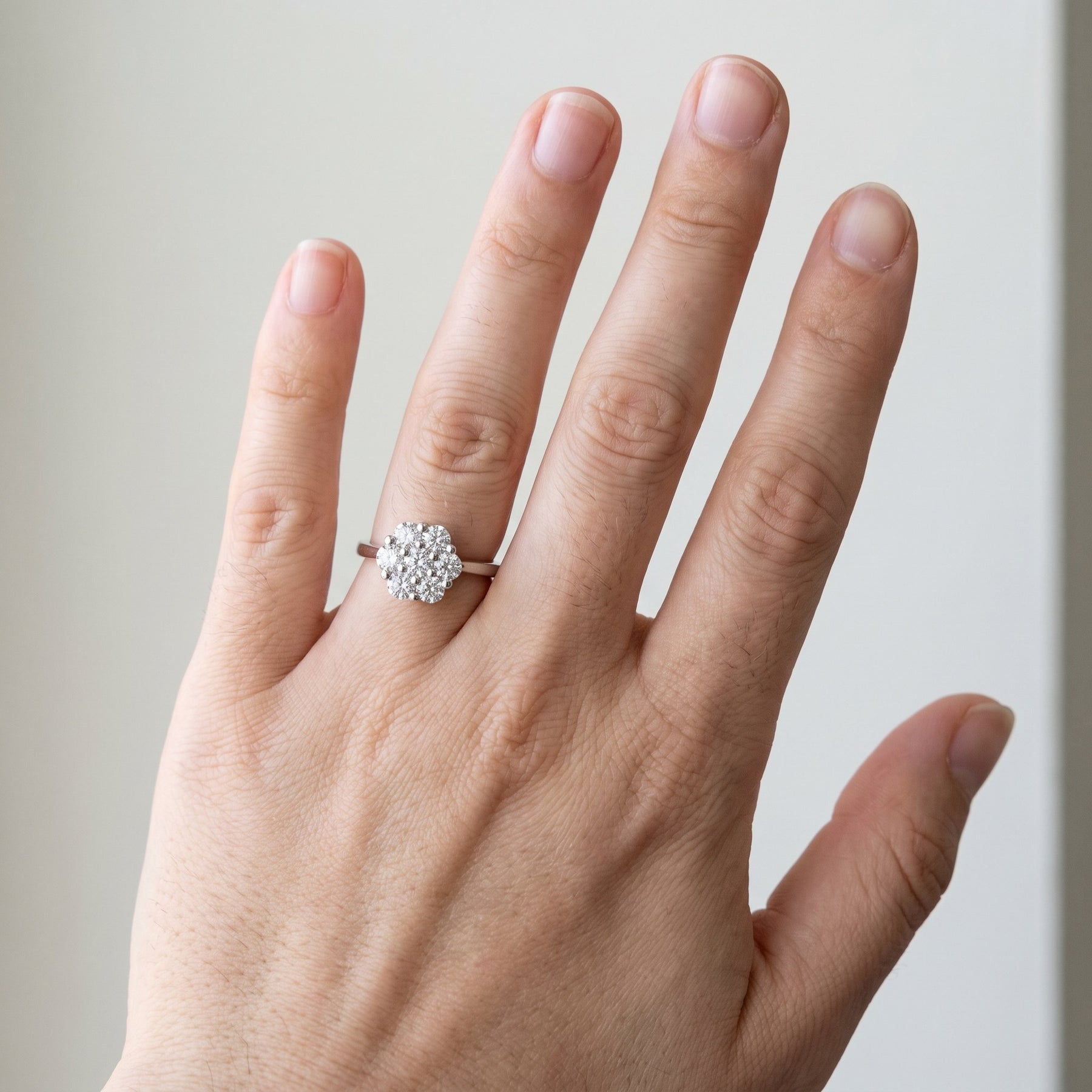 Step three of finding your ring size: the correctly sized moissanite ring worn on the hand