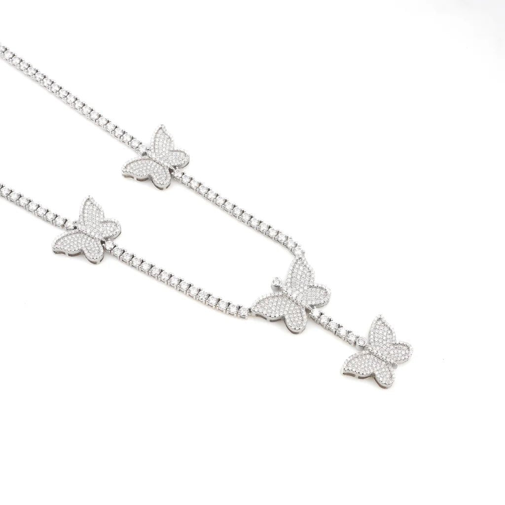 Butterfly 'Dreamline' Tennis Chain featuring delicate butterfly motifs encrusted with sparkling stones along a sleek moissanite chain in .925 silver.