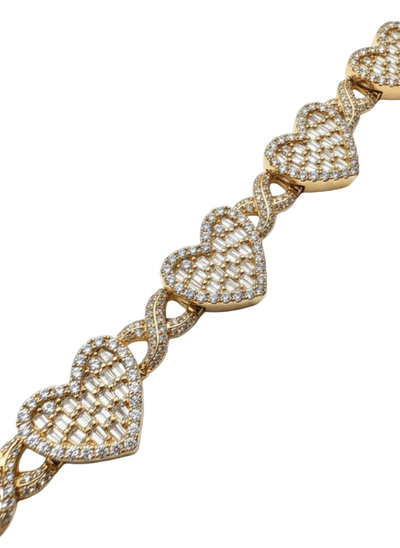 Gold bracelet with heart-shaped links on a white background
