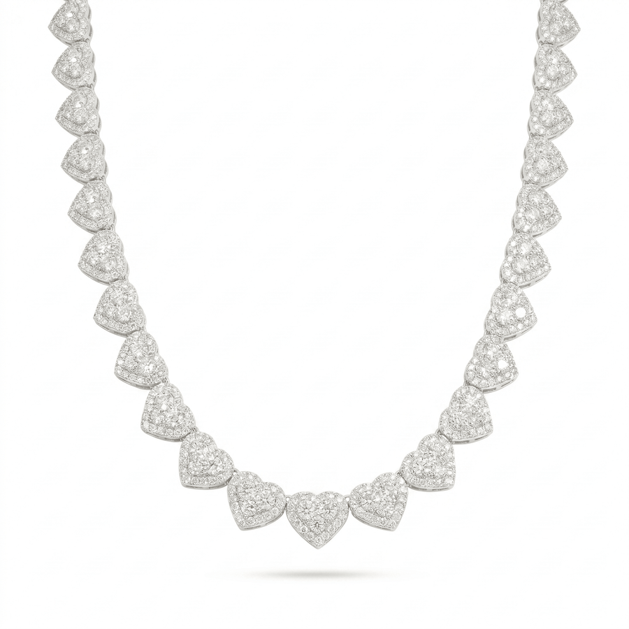 The 'Pure Affection' Linked Heart Chain is a sterling silver necklace with symmetrical heart-shaped clusters encrusted with sparkling VVS lab stones, creating an elegant and luxurious look on a white background.