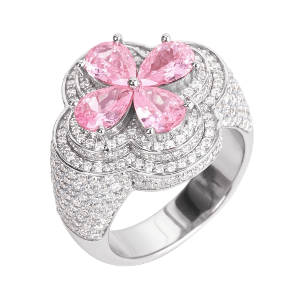 Silver ring with pink gemstones on a white background