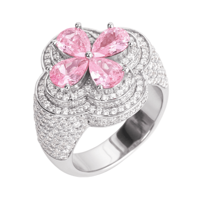 Silver ring with pink gemstones on a white background