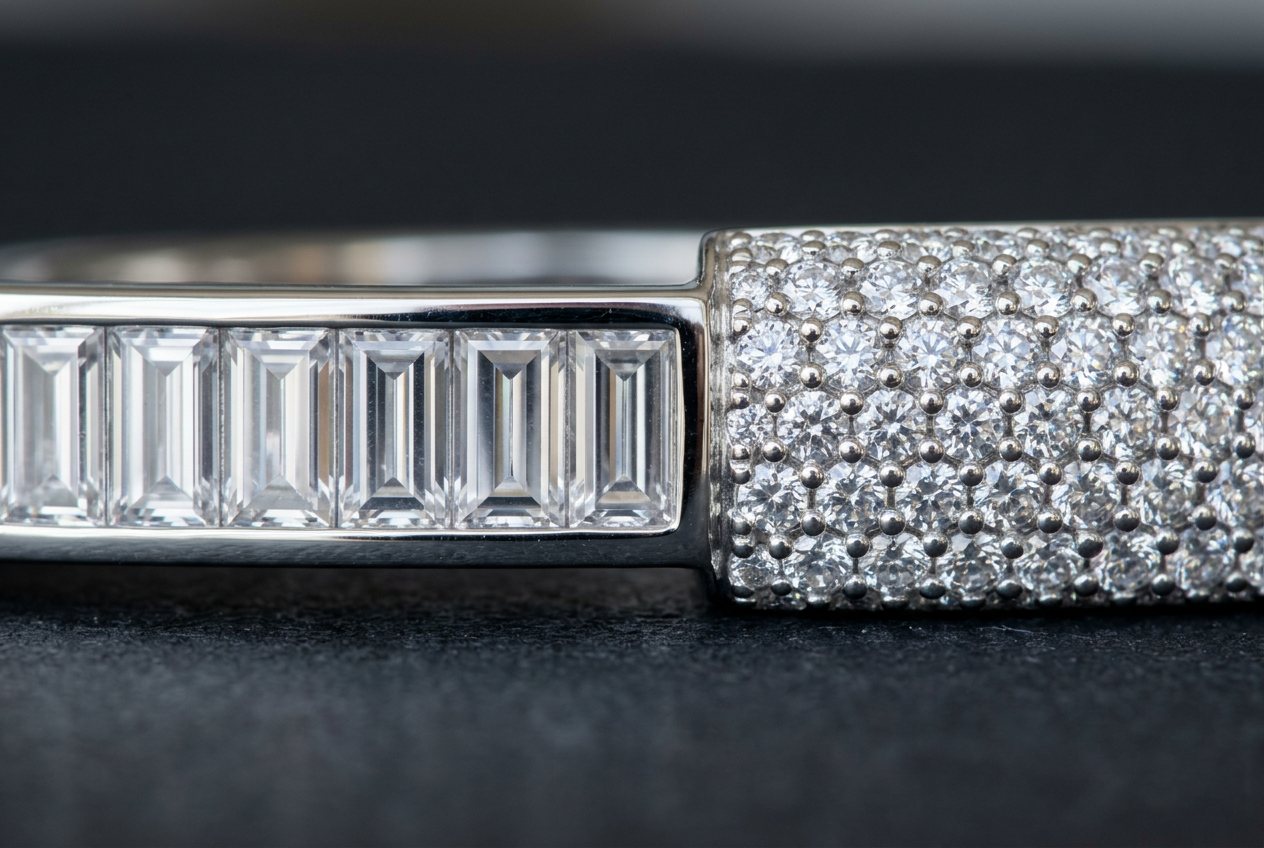 Macro comparison of a row of rectangular baguette cut stones beside a dense field of small round pave set stones