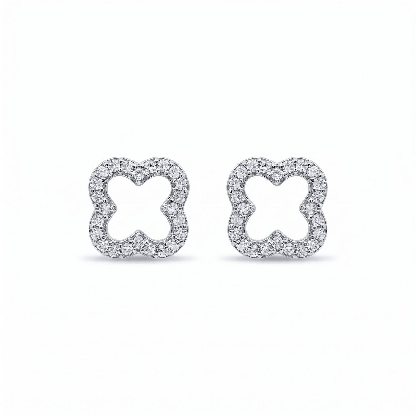 Luxe Clover' Timeless Earrings featuring a delicate clover shape outlined with sparkling VVS moissanite stones set in polished .925 silver for an elegant, timeless look.