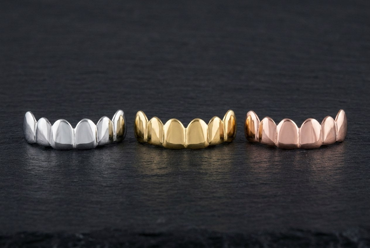 Three custom grillz top rows side by side in white, yellow and rose finishes for comparison