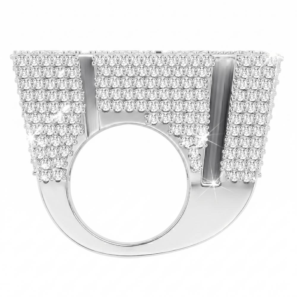 The Custom 'HK' Championship Pinky Ring features a wide, flat silver top with multiple rows of shimmering white gemstones in a bold geometric design—an eye-catching statement piece from Jamilah Jewels.