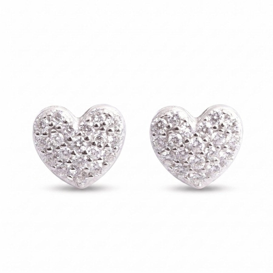 The Timeless Heart Pavé Earrings feature a textured, diamond-like surface with sparkling VVS lab stones set in shiny sterling silver, shown on a plain white background.