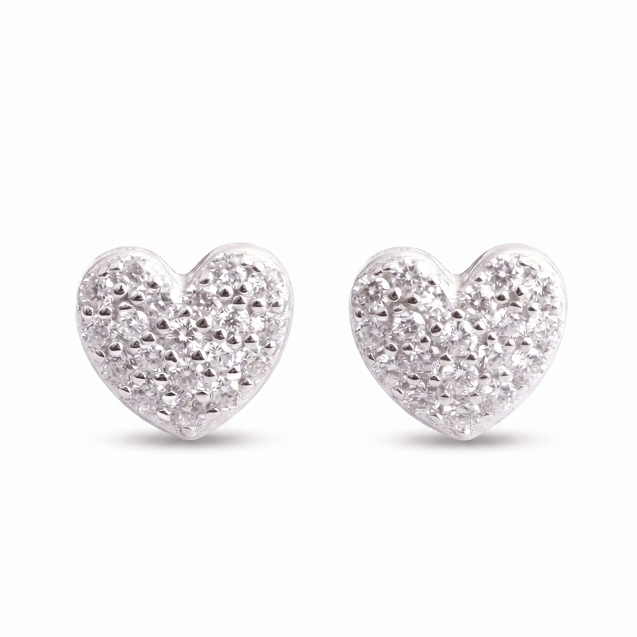 The Timeless Heart Pavé Earrings feature a textured, diamond-like surface with sparkling VVS lab stones set in shiny sterling silver, shown on a plain white background.