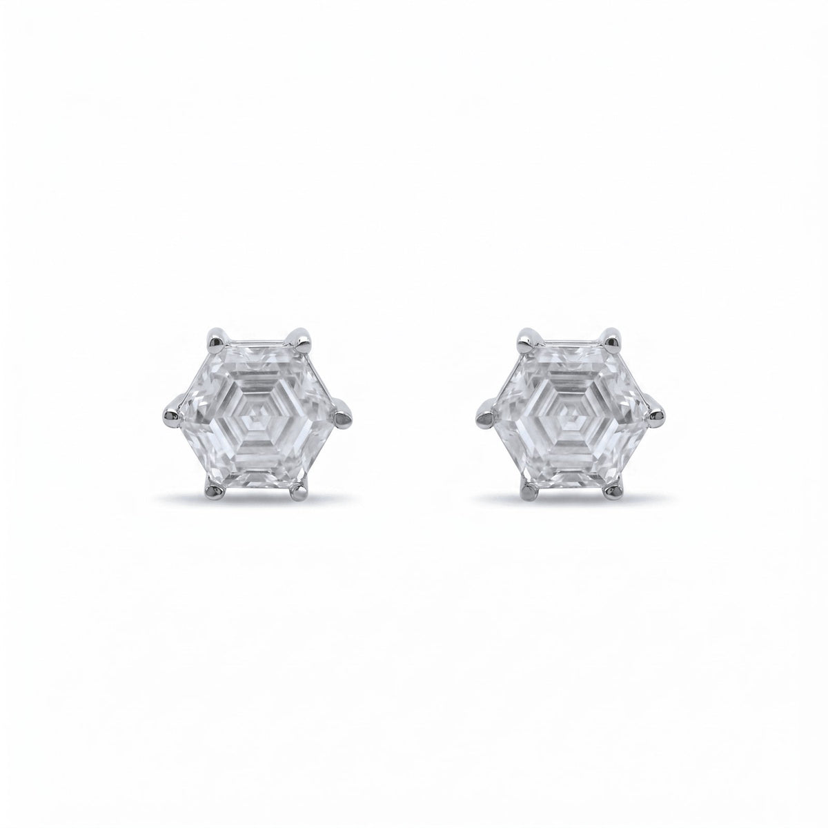 The 'Hexaluxe' Regal Statement Earrings showcase clear gemstones in six-prong settings, blending modern geometric elegance with a striking design—perfect for elevating any look.