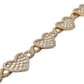 Close-up of a delicate gold link bracelet featuring heart-shaped baguette and round-cut stones with an intricate twisted design, showcasing the ‘Eternal Flame’ Baguette Heart Bracelet.