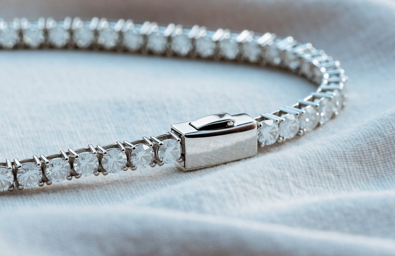 Box clasp and safety latch on a sterling silver moissanite tennis bracelet