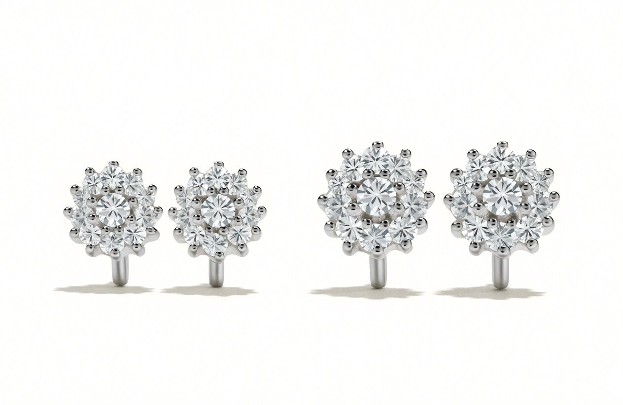 A smaller and a larger pair of round moissanite cluster stud earrings side by side showing the difference in scale