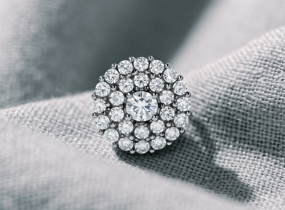 Close up of a round moissanite cluster stud earring in sterling silver with a raised center stone