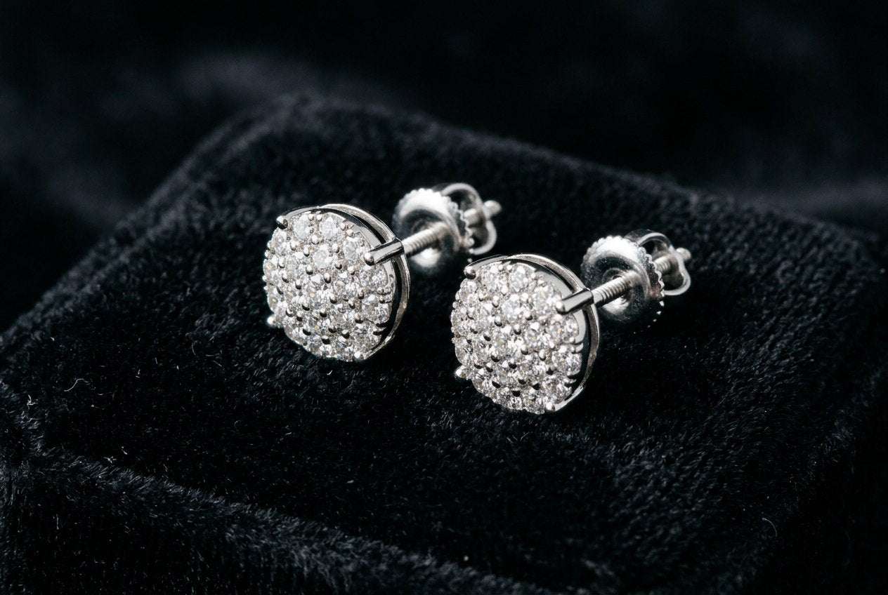 Pair of round moissanite cluster stud earrings on black velvet with their screw-back posts and nuts visible