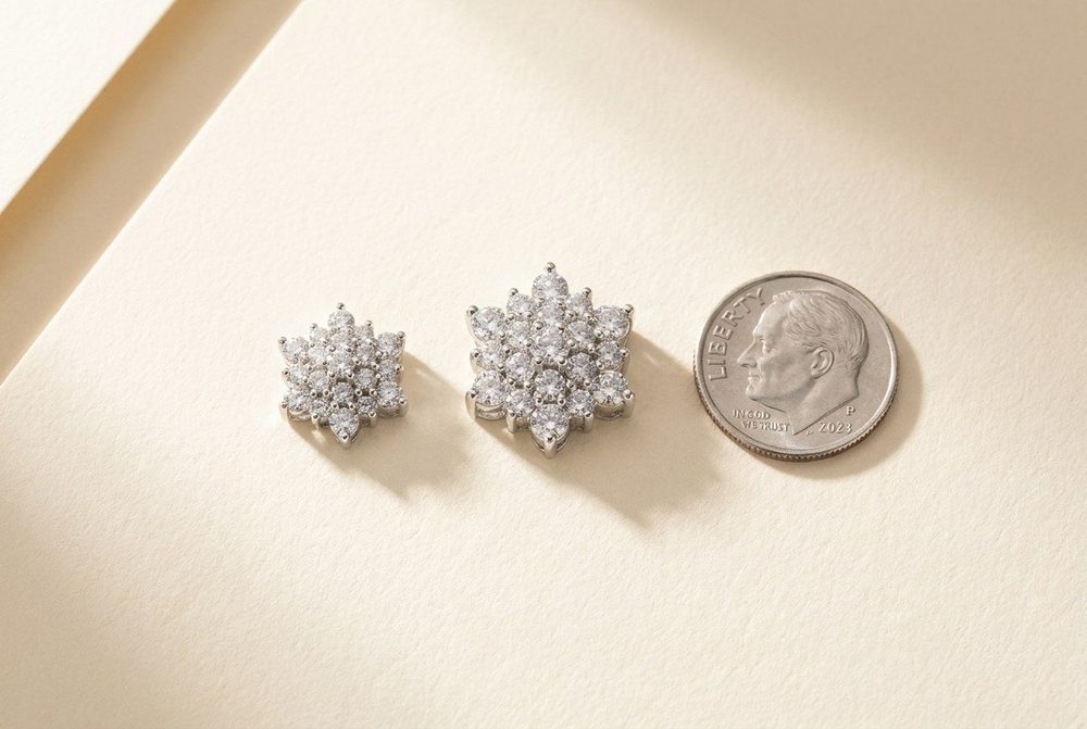 A 9mm and a 12mm moissanite cluster earring beside a US dime for size comparison