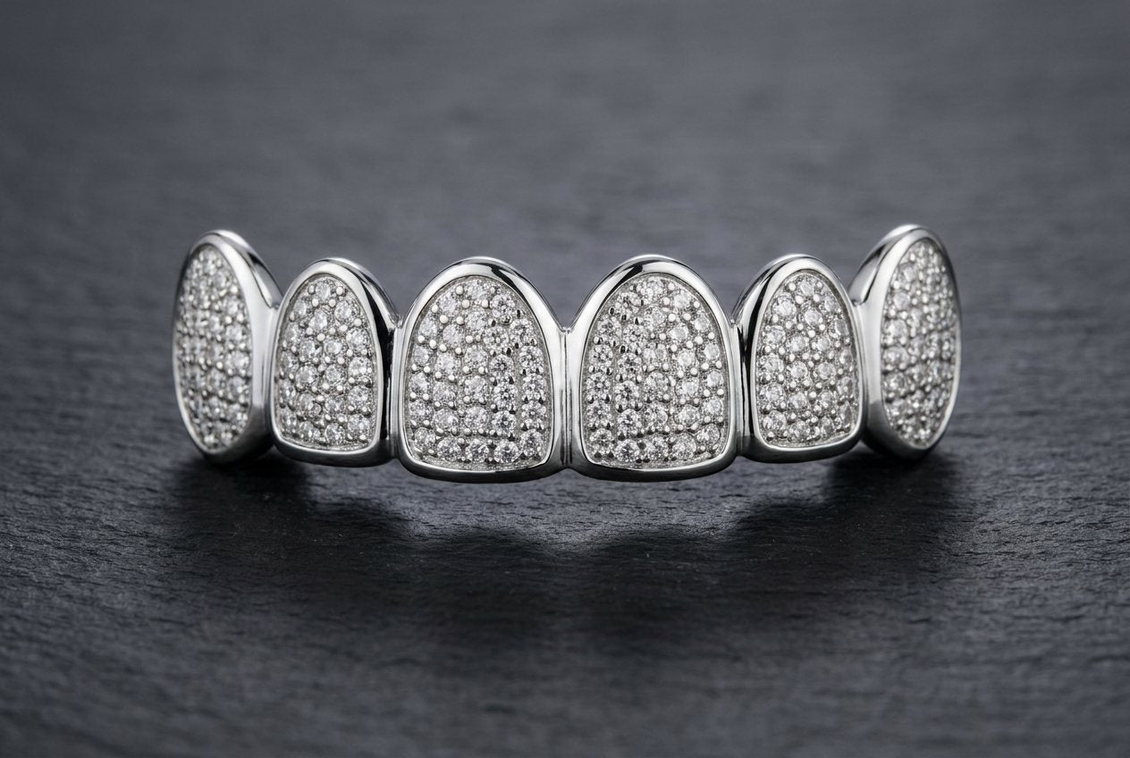 Stone-set custom grillz top row with small round moissanite stones set across each tooth cap