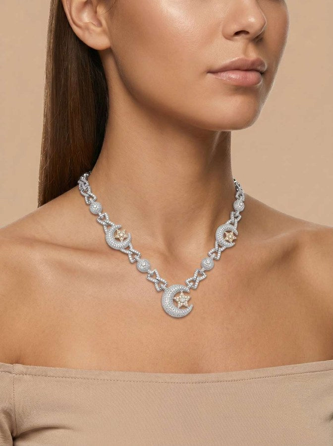 Model wearing a delicate ‘Celestial Crescent’ Lunar Chain featuring crescent moons and stars adorned with sparkling stones in .925 silver, styled with a neutral top.