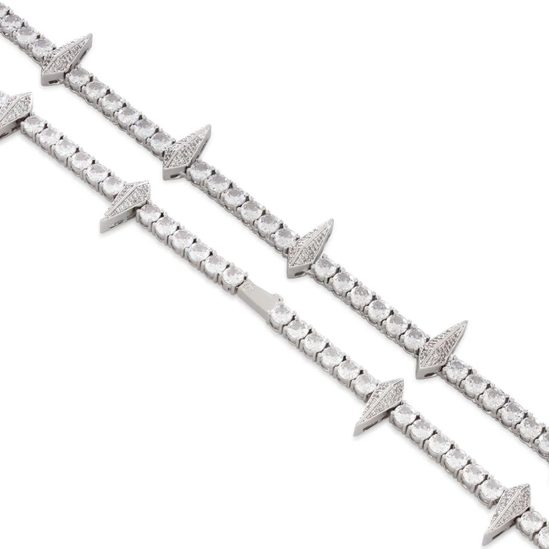 Close-up of a Rockstar Crown Spike Tennis Chain featuring silver links accented with crown-shaped spikes encrusted with small sparkling stones.
