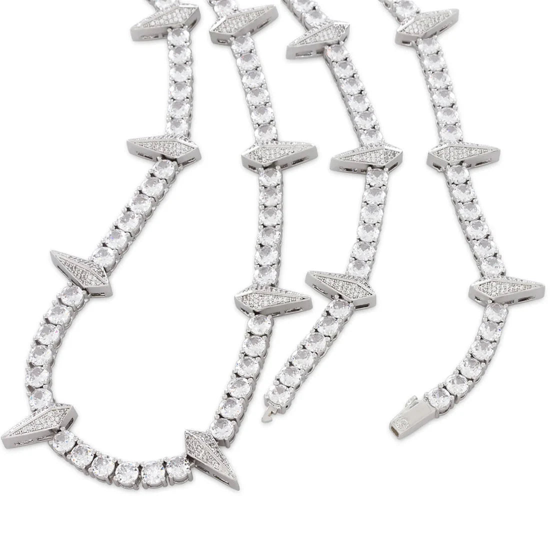 Close-up of a Rockstar Crown Spike Tennis Chain featuring clear stones set in a silver tone with spike-shaped accents along the chain.