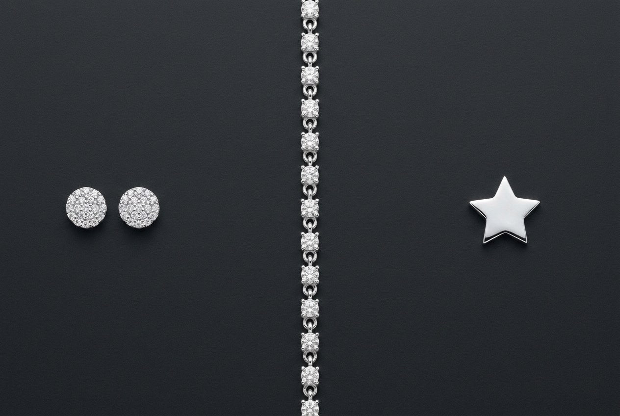 Three polished sterling silver pieces on a dark background: cluster stud earrings, a stone-set bracelet, and a star pendant